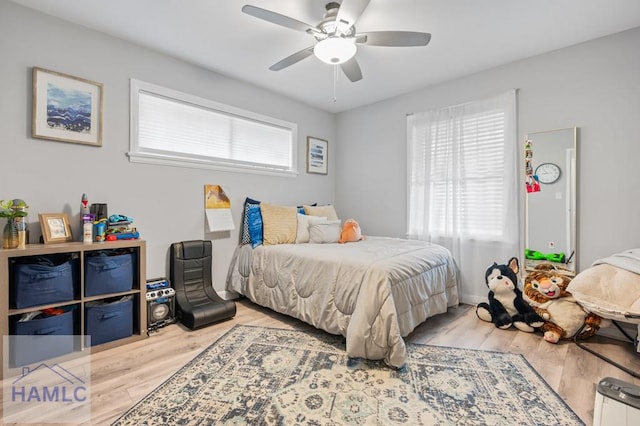 bedroom featuring ceiling fan and light hardwood / wood-style floors