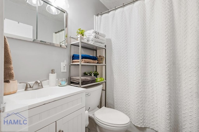 bathroom featuring vanity and toilet