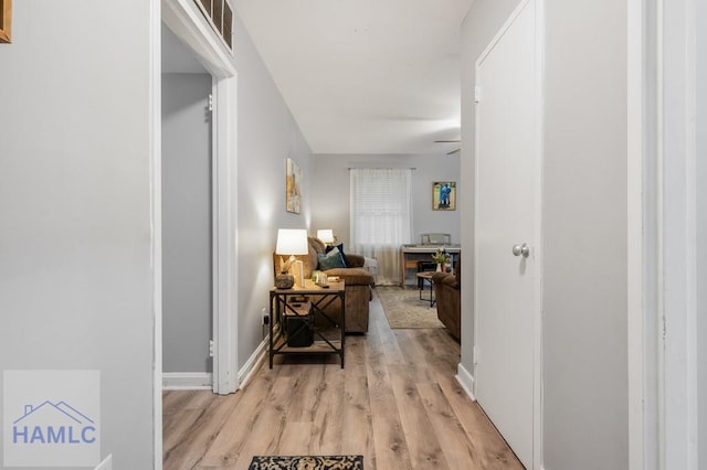 hall with light wood-type flooring