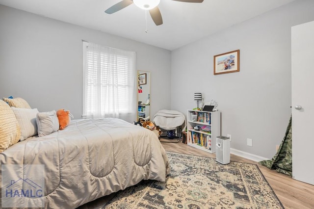 bedroom featuring ceiling fan and wood-type flooring