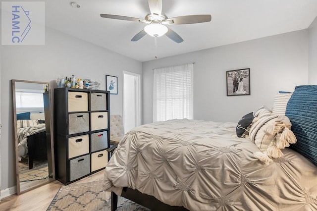 bedroom with ceiling fan and light hardwood / wood-style flooring