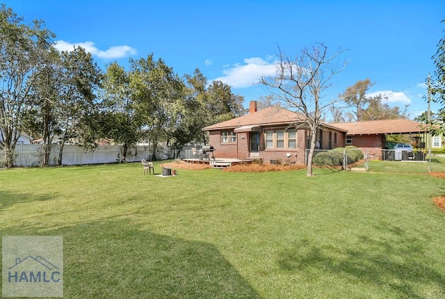 exterior space with brick siding, fence, a chimney, a yard, and crawl space