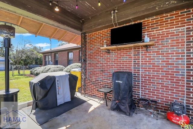 view of patio featuring fence and grilling area