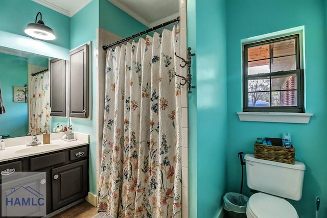 bathroom with vanity, a shower with shower curtain, crown molding, toilet, and tile patterned floors