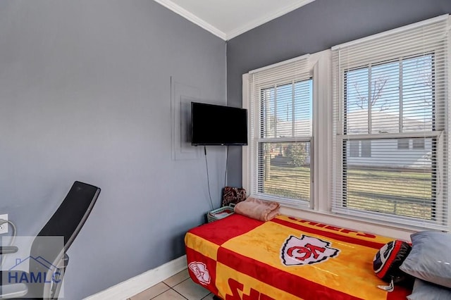 bedroom featuring light tile patterned floors, baseboards, and ornamental molding