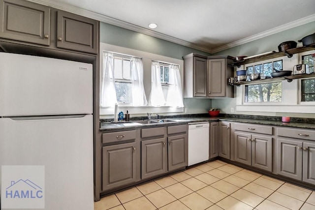 kitchen featuring a sink, white appliances, and gray cabinetry