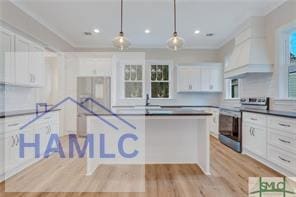 49 Salt Marsh Dr, Midway, GA 31320 - kitchen with white cabinetry, light wood-style flooring, stainless steel electric range, decorative light fixtures, and recessed lighting