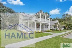 49 Salt Marsh Dr, Midway, GA 31320 - view of front of house with a balcony, a front lawn, and a porch