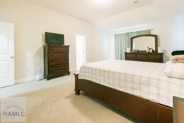 carpeted bedroom with lofted ceiling