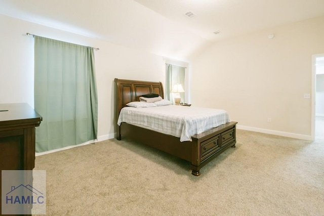 carpeted bedroom with vaulted ceiling