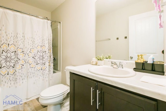 full bathroom featuring shower / bath combo, vanity, toilet, and wood-type flooring