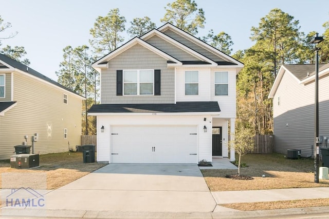 view of front of house featuring cooling unit and a garage