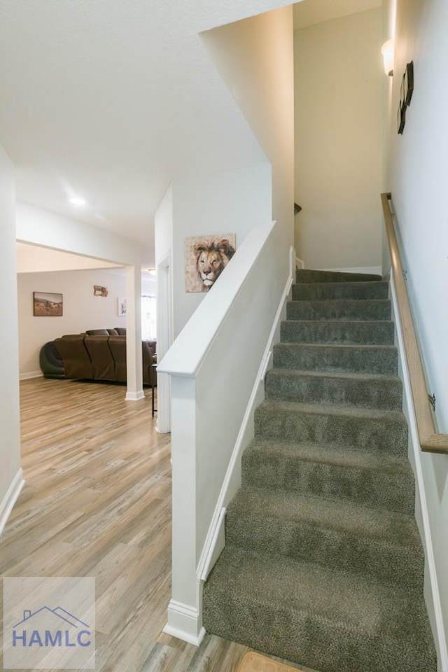 stairway with wood-type flooring