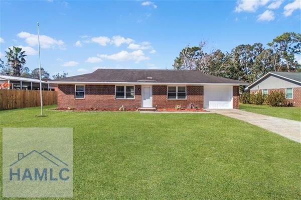 ranch-style house featuring a garage and a front lawn