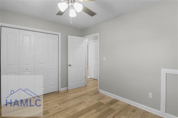 unfurnished bedroom with light wood-type flooring, a closet, and ceiling fan