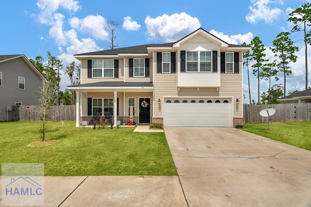 view of front of property featuring a front lawn and a garage