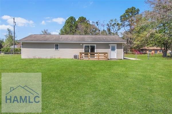 1110 Ricade Dr, Hinesville, GA 31313 - rear view of house with a yard and central AC unit