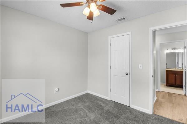 1110 Ricade Dr, Hinesville, GA 31313 - carpeted spare room with visible vents, baseboards, and a ceiling fan
