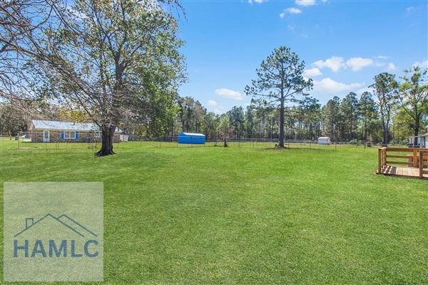 1110 Ricade Dr, Hinesville, GA 31313 - view of yard featuring fence