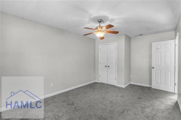 1110 Ricade Dr, Hinesville, GA 31313 - unfurnished bedroom with a closet, baseboards, ceiling fan, and carpet