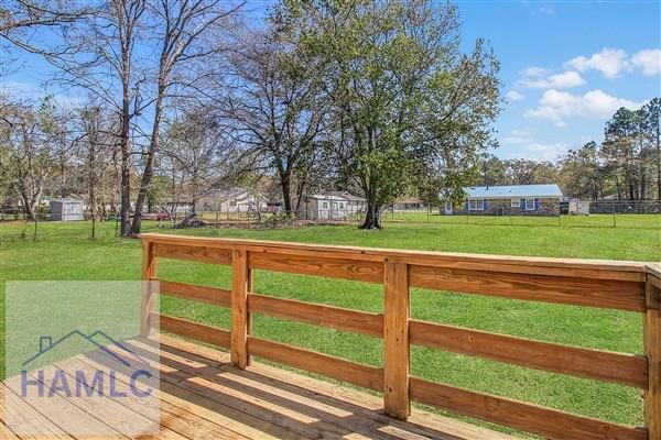 1110 Ricade Dr, Hinesville, GA 31313 - wooden terrace with fence and a lawn