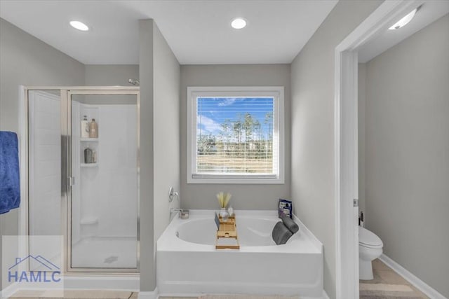 bathroom featuring toilet, tile patterned flooring, and plus walk in shower