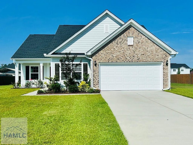 173 Akins Ranch Rd NE, Ludowici, GA 31316 - single story home with brick siding, concrete driveway, and a garage