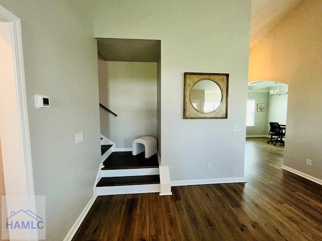 173 Akins Ranch Rd NE, Ludowici, GA 31316 - hall featuring wood finished floors, arched walkways, and stairs