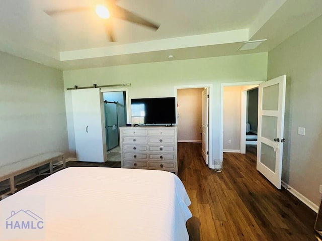 173 Akins Ranch Rd NE, Ludowici, GA 31316 - bedroom with dark wood-style floors, ceiling fan, and a barn door