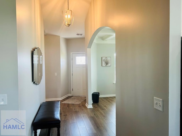 173 Akins Ranch Rd NE, Ludowici, GA 31316 - foyer entrance with arched walkways and dark wood-style floors