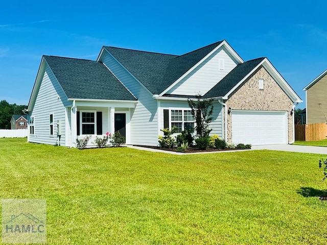 173 Akins Ranch Rd NE, Ludowici, GA 31316 - view of front of property with an attached garage, concrete driveway, and a shingled roof