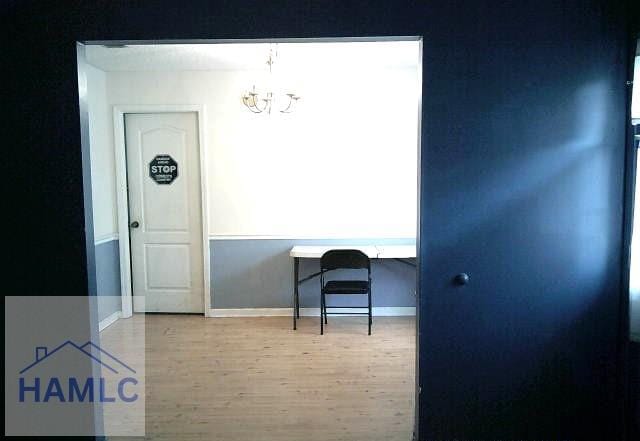 1013 Barley Dr, Hinesville, GA 31313 - interior space with an inviting chandelier, wood finished floors, and baseboards