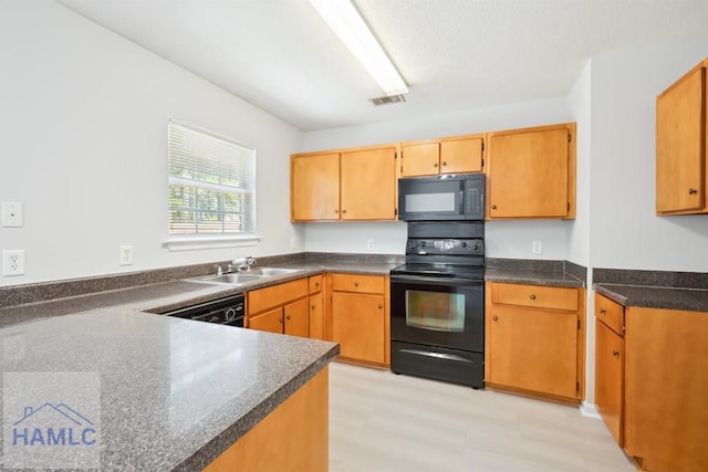 24 Stalwick Dr, Pooler, GA 31322 - kitchen featuring black appliances, a sink, dark countertops, and light flooring