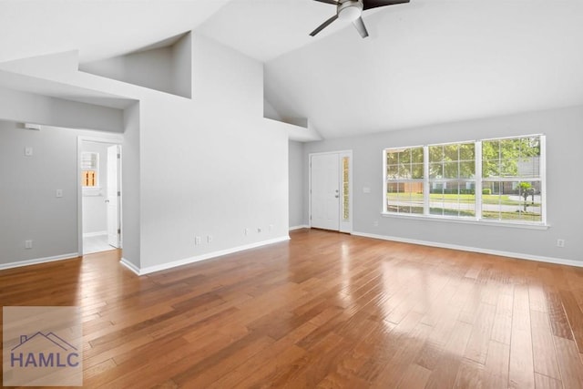 24 Stalwick Dr, Pooler, GA 31322 - unfurnished living room featuring ceiling fan, high vaulted ceiling, wood-type flooring, and baseboards