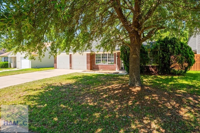24 Stalwick Dr, Pooler, GA 31322 - view of property hidden behind natural elements with driveway, brick siding, and an attached garage