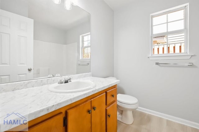24 Stalwick Dr, Pooler, GA 31322 - bathroom featuring toilet, vanity, wood finished floors, baseboards, and a shower