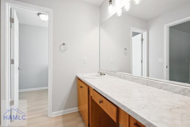 24 Stalwick Dr, Pooler, GA 31322 - bathroom featuring vanity, baseboards, and wood finished floors