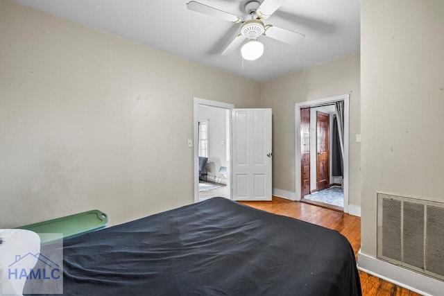 bedroom featuring hardwood / wood-style flooring and ceiling fan