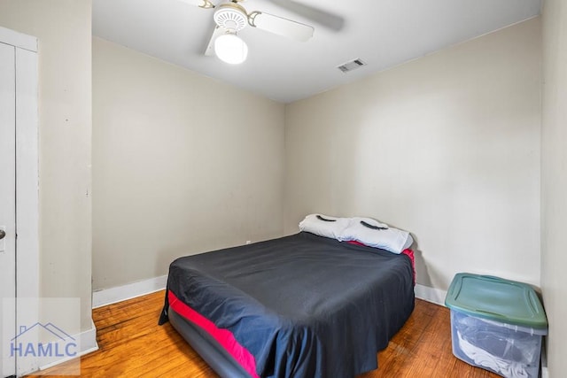 bedroom with hardwood / wood-style flooring and ceiling fan