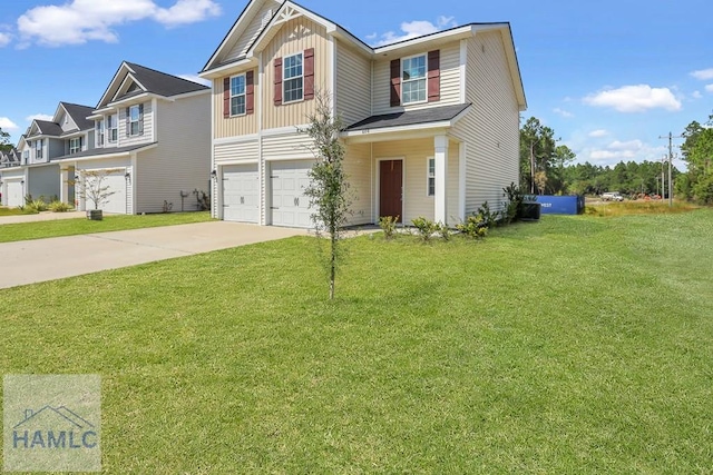 view of front of property featuring a garage and a front yard