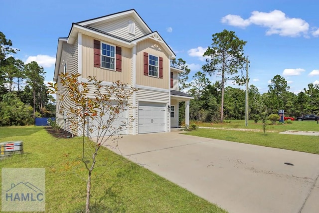 view of front of home with a front lawn and a garage