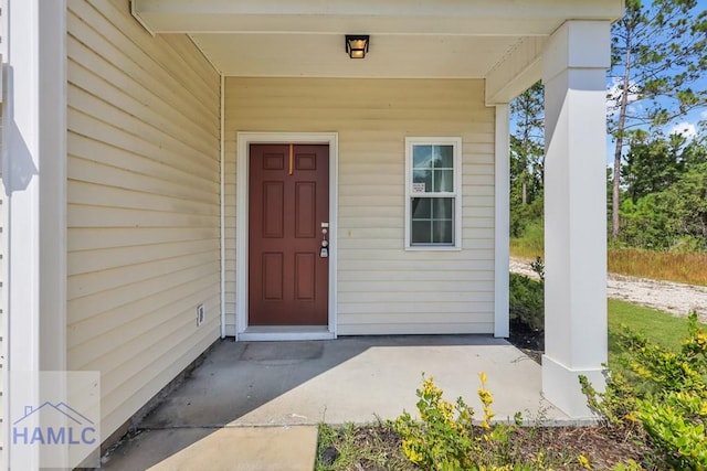 doorway to property with a porch