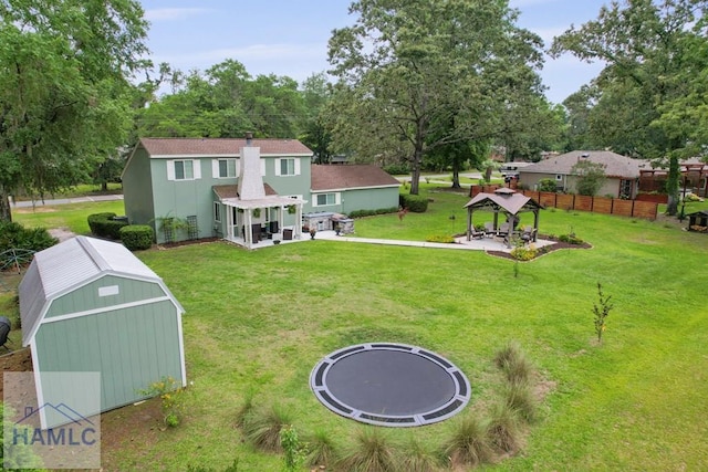 226 Topi Trl, Hinesville, GA 31313 - view of yard featuring a gazebo, a trampoline, a pergola, and a patio area