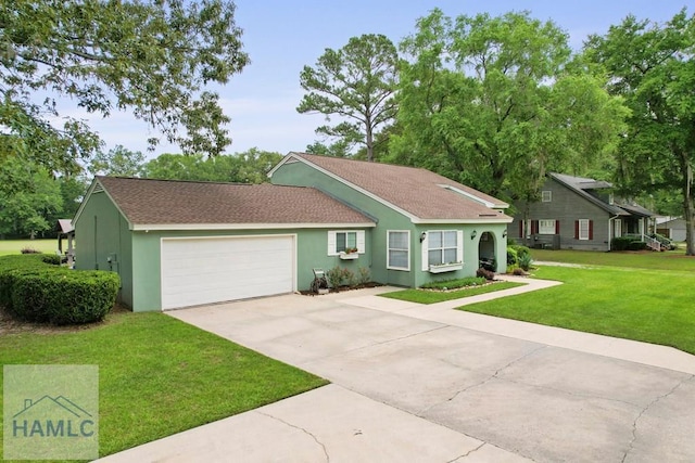 226 Topi Trl, Hinesville, GA 31313 - view of front of home featuring driveway, stucco siding, a garage, and a front lawn