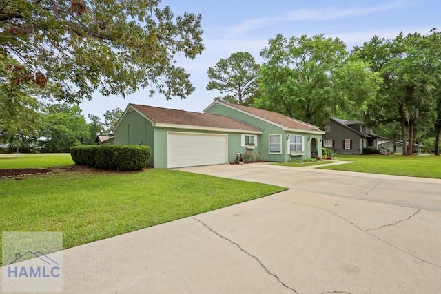226 Topi Trl, Hinesville, GA 31313 - ranch-style house featuring a garage, driveway, a front lawn, and stucco siding