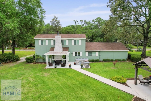 226 Topi Trl, Hinesville, GA 31313 - rear view of house featuring a gazebo, a patio, stucco siding, and a lawn