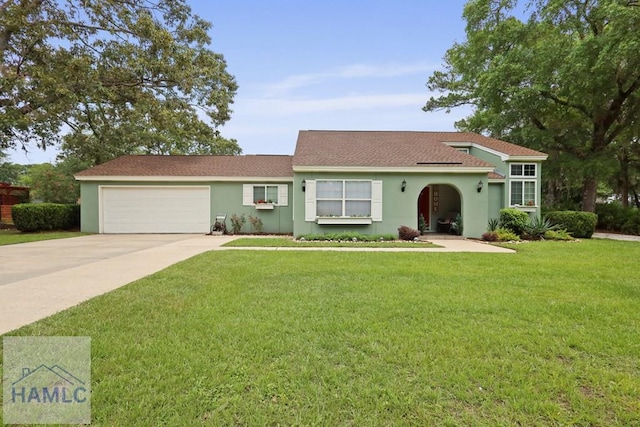 226 Topi Trl, Hinesville, GA 31313 - view of front of property featuring concrete driveway, stucco siding, an attached garage, and a front yard