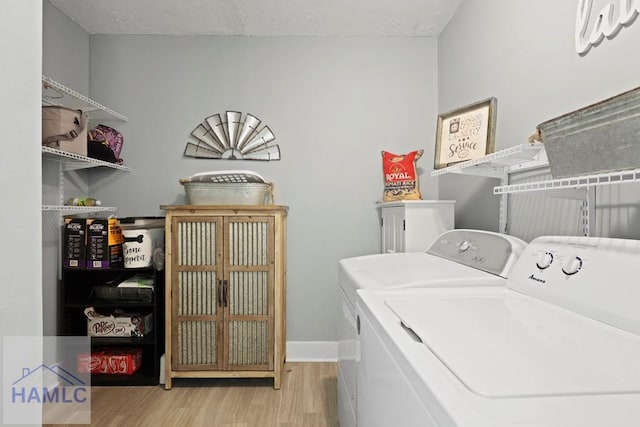 226 Topi Trl, Hinesville, GA 31313 - laundry room with washing machine and clothes dryer and light wood finished floors