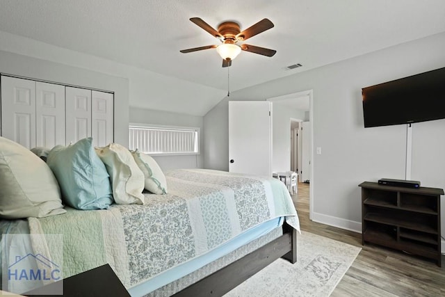 226 Topi Trl, Hinesville, GA 31313 - bedroom with wood finished floors, baseboards, a ceiling fan, a closet, and lofted ceiling