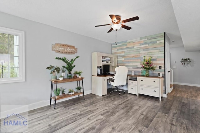 226 Topi Trl, Hinesville, GA 31313 - office featuring ceiling fan, dark wood finished floors, baseboards, and an accent wall